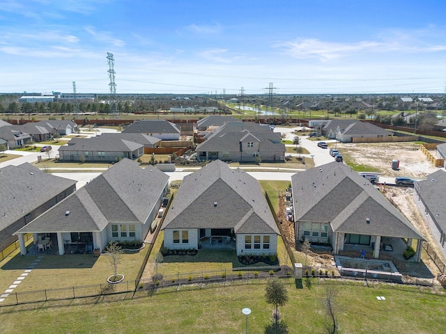 birds eye view of property with a residential view