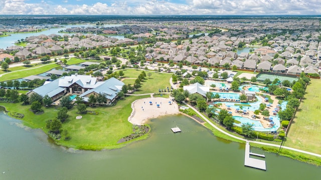 bird's eye view featuring a water view and a residential view