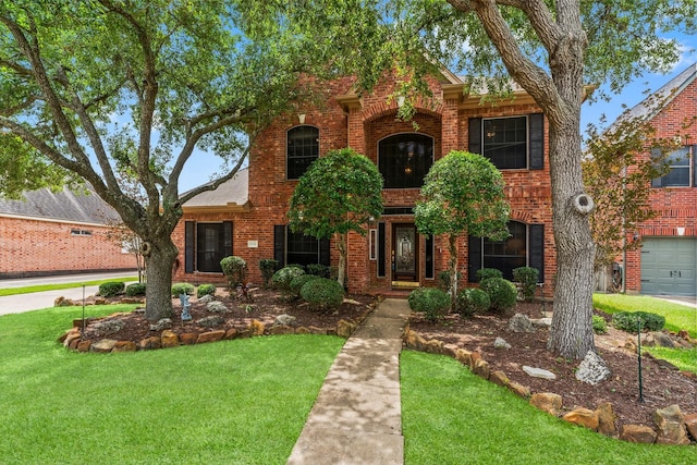 traditional home featuring brick siding and a front lawn