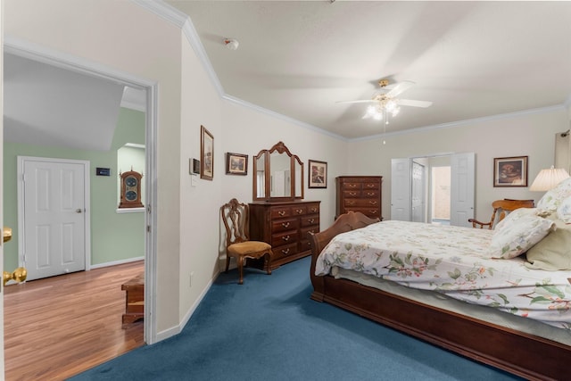 bedroom featuring baseboards, ornamental molding, and a ceiling fan