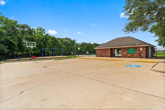 exterior space featuring fence and community basketball court