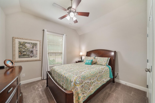 carpeted bedroom with baseboards, a ceiling fan, and vaulted ceiling