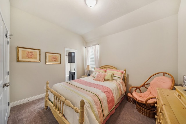 carpeted bedroom featuring baseboards, ensuite bathroom, and vaulted ceiling