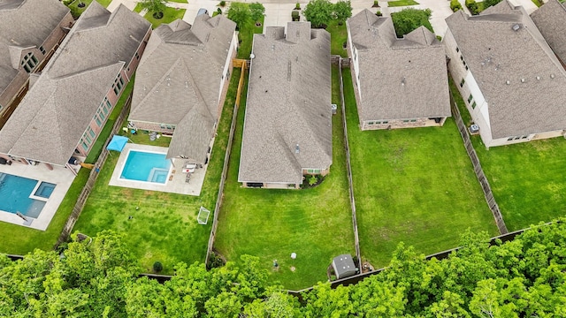 birds eye view of property with a residential view