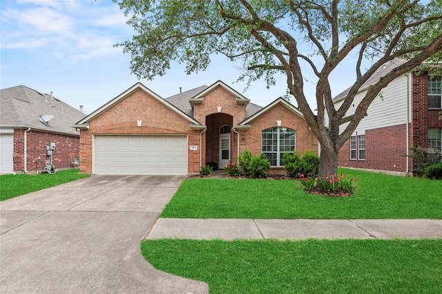 ranch-style home with brick siding, driveway, a front lawn, and a garage