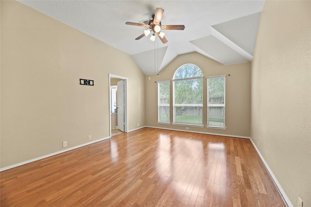unfurnished living room featuring light wood-style floors, baseboards, and ceiling fan