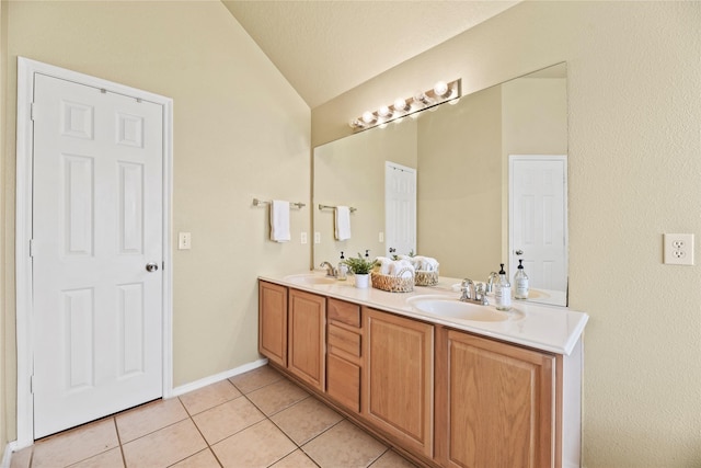 19814 Wren Forest Ln, Houston, TX 77084 - full bath featuring double vanity, a sink, lofted ceiling, and tile patterned floors