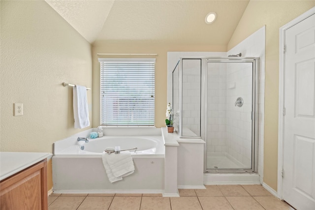 full bath with tile patterned floors, a shower stall, and lofted ceiling