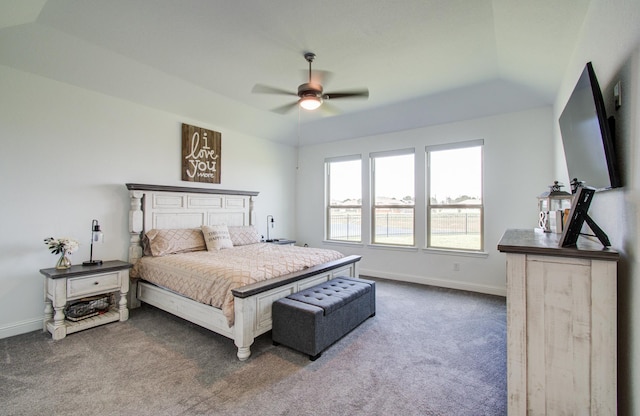 bedroom featuring a ceiling fan, baseboards, and dark carpet