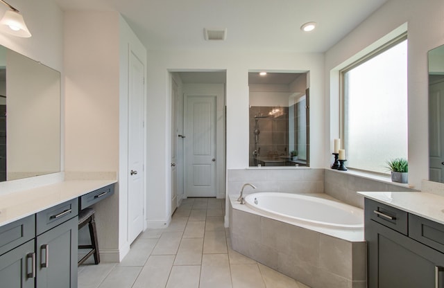 19018 Valentine Padlock Cir, Tomball, TX 77377 - bathroom featuring healthy amount of natural light, a shower stall, a garden tub, vanity, and recessed lighting