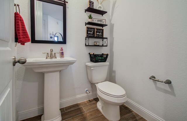 19018 Valentine Padlock Cir, Tomball, TX 77377 - bathroom featuring wood finished floors, toilet, baseboards, and decorative columns