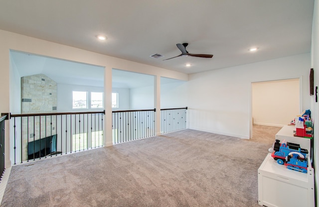 carpeted empty room with visible vents, a ceiling fan, and recessed lighting