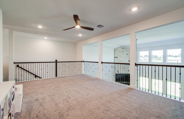 carpeted spare room featuring recessed lighting, ceiling fan, and visible vents