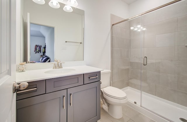 full bath featuring vanity, tile patterned floors, a stall shower, and toilet