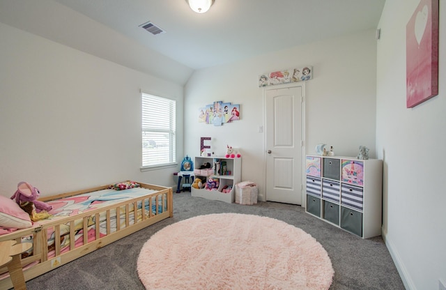 carpeted bedroom with baseboards, vaulted ceiling, and visible vents