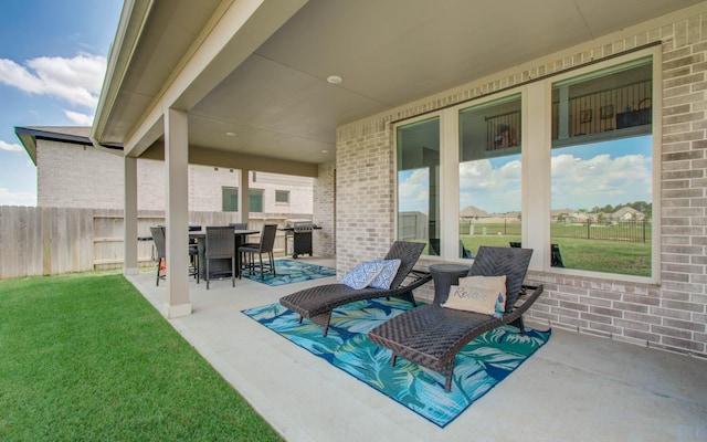 view of patio / terrace with area for grilling, fence, and outdoor dining space