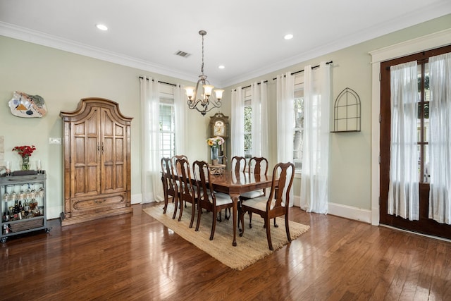 8 Latitude Ln, Galveston, TX 77554 - dining space featuring a notable chandelier, visible vents, a wealth of natural light, and wood finished floors