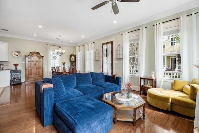 8 Latitude Ln, Galveston, TX 77554 - living room with recessed lighting, wood finished floors, and ceiling fan with notable chandelier