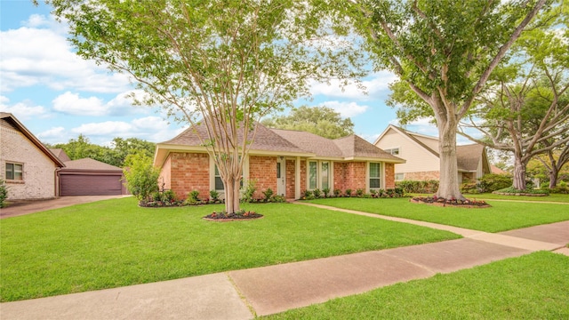 2706 Williams Grant St, Sugar Land, TX 77479 - ranch-style house featuring brick siding, a front lawn, an outbuilding, and a detached garage