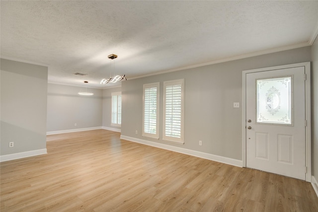 2706 Williams Grant St, Sugar Land, TX 77479 - foyer entrance with crown molding, light wood-style flooring, a textured ceiling, and baseboards