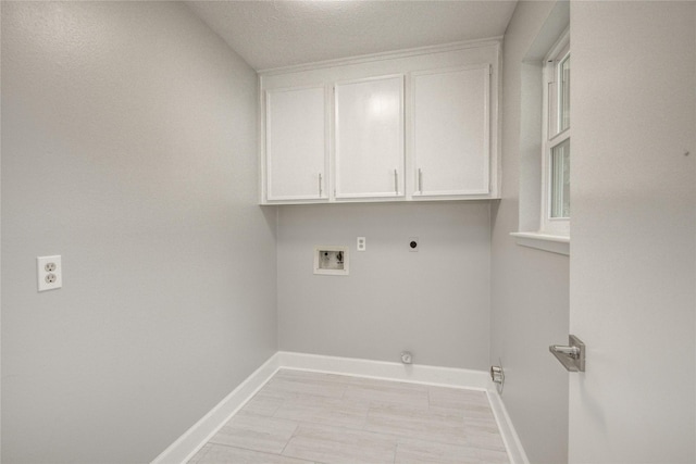 2706 Williams Grant St, Sugar Land, TX 77479 - washroom with baseboards, hookup for a washing machine, hookup for an electric dryer, cabinet space, and hookup for a gas dryer