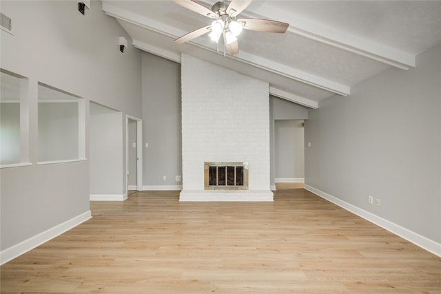 2706 Williams Grant St, Sugar Land, TX 77479 - unfurnished living room with visible vents, beam ceiling, a fireplace, ceiling fan, and light wood-type flooring