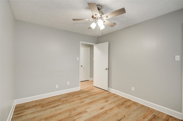 2706 Williams Grant St, Sugar Land, TX 77479 - unfurnished room featuring baseboards, a ceiling fan, and light wood-style floors