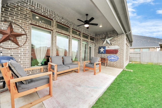 view of patio / terrace featuring a ceiling fan, outdoor lounge area, and fence