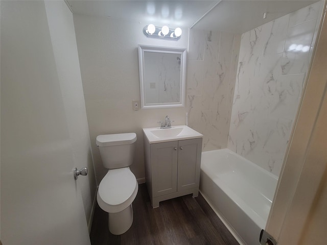 full bathroom with vanity, tub / shower combination, wood finished floors, and toilet