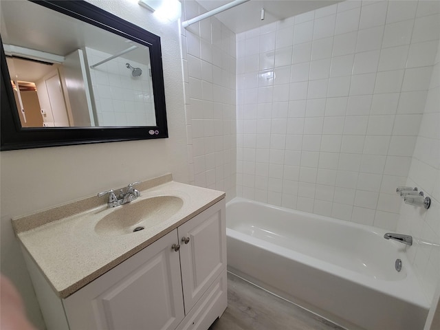 bathroom with vanity and tub / shower combination