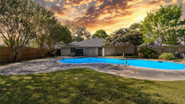 view of pool with a lawn, a fenced backyard, a fenced in pool, and a patio