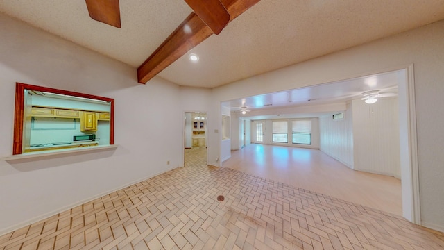 empty room featuring beamed ceiling, recessed lighting, ceiling fan, and baseboards