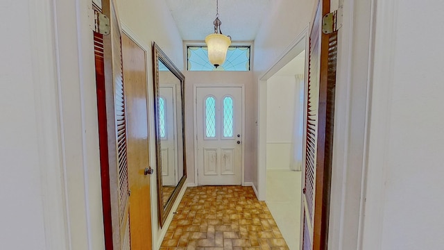 entryway featuring brick floor