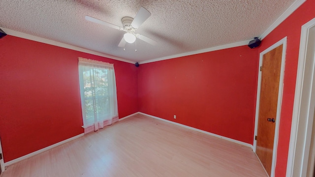 spare room featuring crown molding, a ceiling fan, a textured ceiling, and wood finished floors