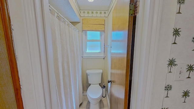 full bathroom featuring toilet