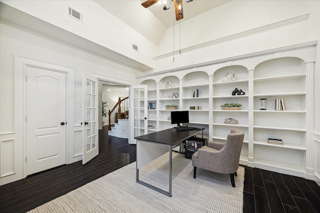 office area featuring dark wood-type flooring, ceiling fan, vaulted ceiling, and visible vents