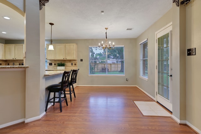 dining space with visible vents, recessed lighting, baseboards, and wood finished floors
