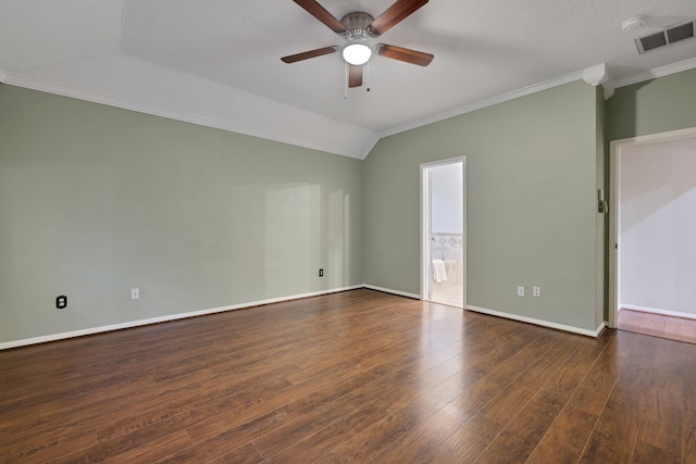 spare room featuring crown molding, visible vents, lofted ceiling, wood finished floors, and ceiling fan