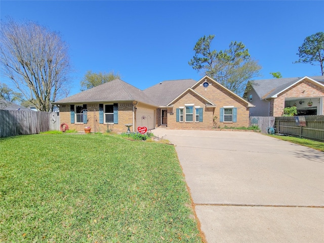 single story home featuring driveway, a front yard, a garage, brick siding, and fence