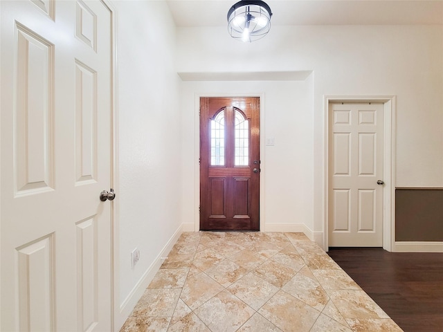 entrance foyer featuring baseboards