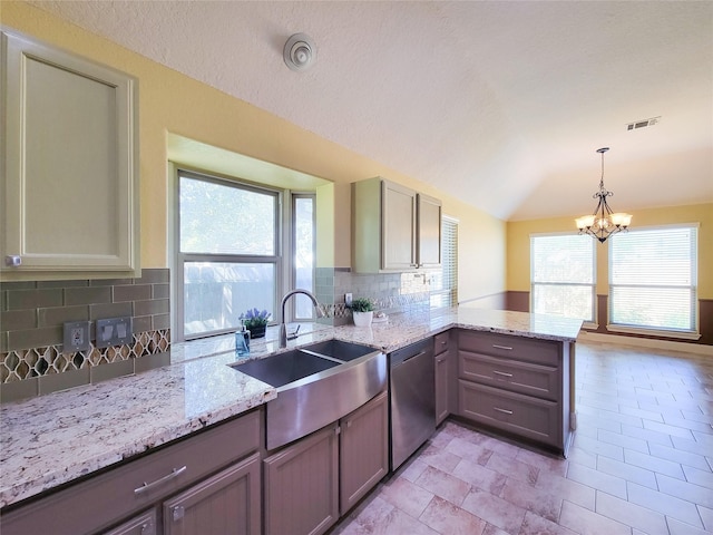 kitchen with visible vents, tasteful backsplash, dishwasher, a sink, and a peninsula