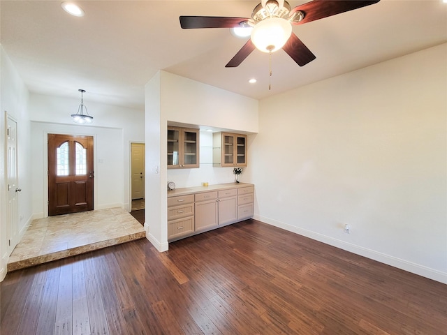 foyer entrance featuring recessed lighting, baseboards, and dark wood-style flooring