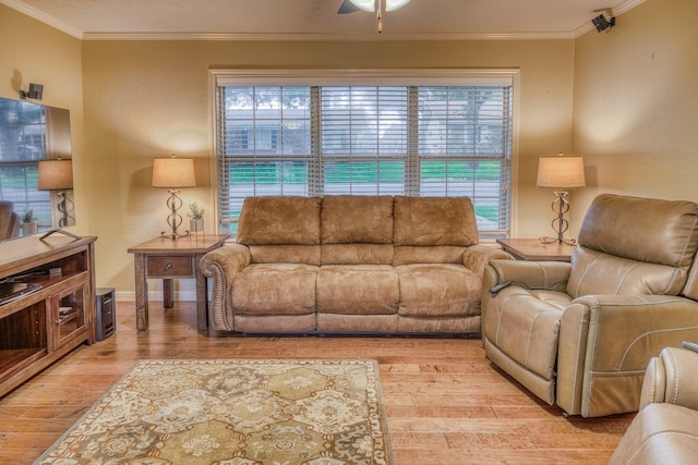 1302 Woodson Ln, Brenham, TX 77833 - living room with light wood-style floors, crown molding, ceiling fan, and baseboards