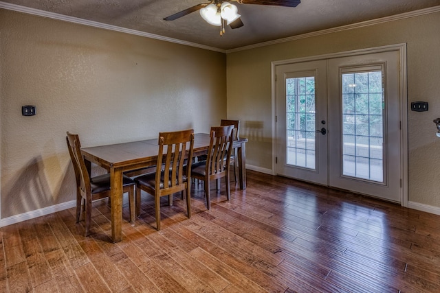 dining room featuring a textured wall, wood-type flooring, french doors, a ceiling fan, and baseboards