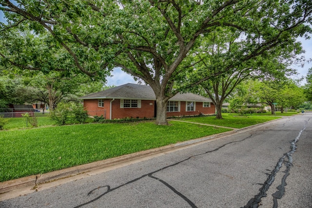 1302 Woodson Ln, Brenham, TX 77833 - single story home with brick siding