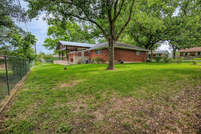 view of yard featuring a fenced backyard and central AC unit