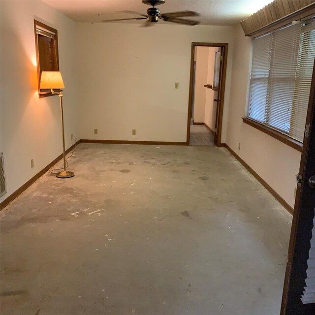 169 Lakeview Pnes, Livingston, TX 77351 - unfurnished room featuring concrete floors, ceiling fan, and baseboards