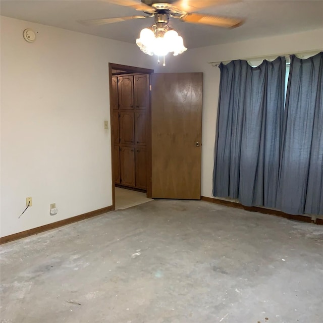 169 Lakeview Pnes, Livingston, TX 77351 - spare room with ceiling fan, concrete floors, a smoke detector, and baseboards