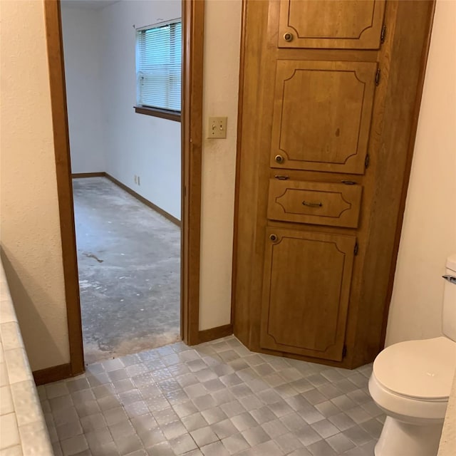 169 Lakeview Pnes, Livingston, TX 77351 - bathroom featuring toilet and baseboards