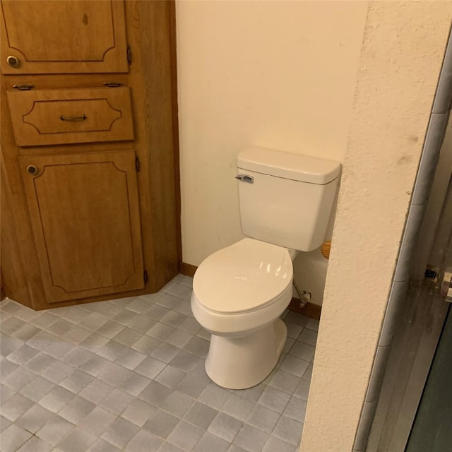 169 Lakeview Pnes, Livingston, TX 77351 - bathroom featuring tile patterned flooring and toilet